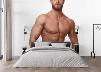 Young bodybuilder with muscular body on white background Wall mural