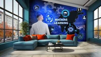 Young businessman near virtual screen with machine learning model and night cityscape on background Wall mural