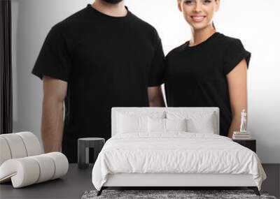 Young couple in t-shirts on white background. Mockup for design Wall mural