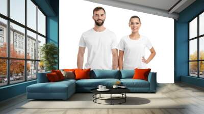 Young couple in t-shirts on white background. Mockup for design Wall mural