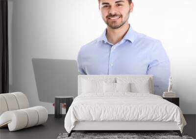 young man with laptop on white background Wall mural