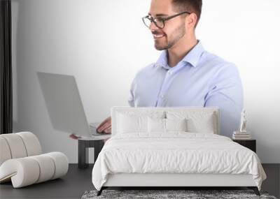 Young man with laptop on white background Wall mural