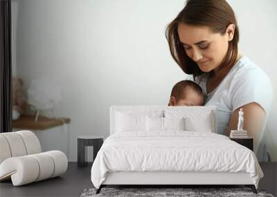 Young mother with her cute baby at home Wall mural