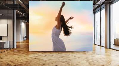 Young woman enjoying summer day against sky. Freedom of zen Wall mural