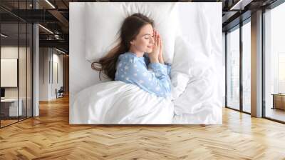 Young woman sleeping on comfortable pillow in bed at home, top view Wall mural