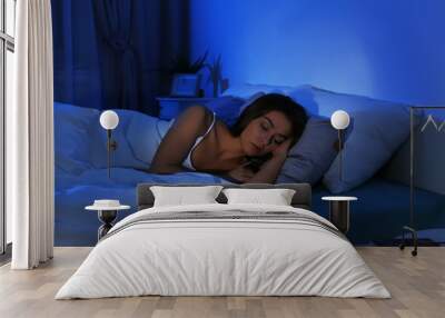 Young woman suffering from insomnia at home. Bedtime Wall mural