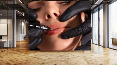 Young woman undergoing procedure of permanent lip makeup in tattoo salon, closeup Wall mural