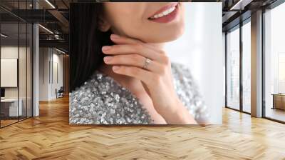 Young woman wearing beautiful engagement ring, closeup Wall mural