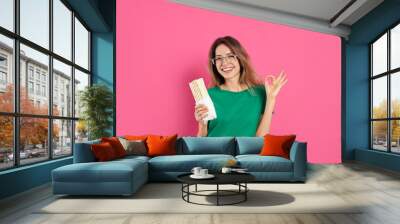 Young woman with delicious shawarma on pink background Wall mural