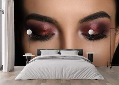 Young woman with evening makeup, closeup. Eye shadow product Wall mural