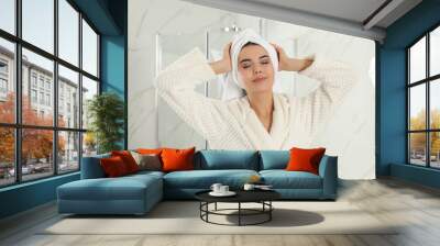 Young woman with hair wrapped in towel indoors Wall mural