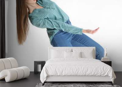 Young woman with magnet attracting people on white background Wall mural