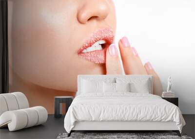 Young woman with sugar lips on white background, closeup Wall mural