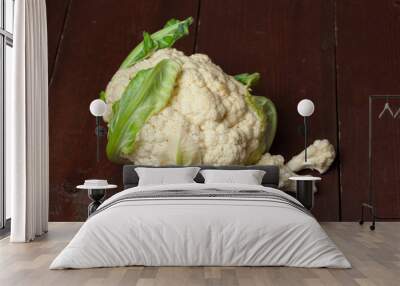 Fresh cauliflower cabbage on a dark wooden background Wall mural