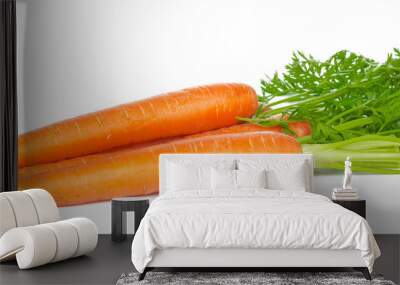 Isolated carrots. Heap of fresh carrots with stems isolated on white background Wall mural