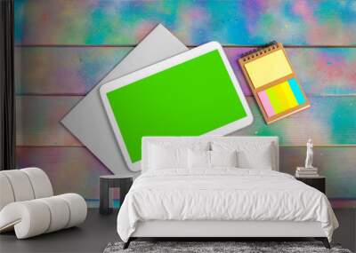 Modern blank digital tablet with papers and pen on a wooden desk. Top view. High quality Wall mural