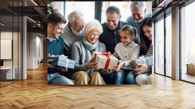 family, holidays, generation, christmas and people concept - happy family with gift boxes sitting on sofa at home Wall mural