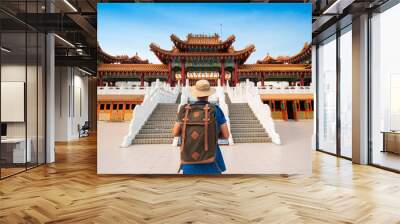 Man backpacker tourist is visiting Thean Hou Temple in Kuala Lumpur, Malaysia. Wall mural