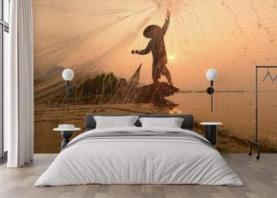 Two fishermen are fishing on the boat at Mekong river in the morning in Nong Khai, Thailand Wall mural