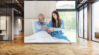 Nurse taking care and careful caregiver senior man in Home., Medical staff and home occupants concept. Wall mural