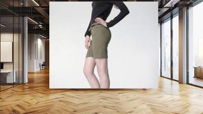 Side view full length of young female in casual standing Wall mural