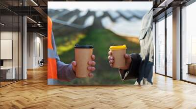 Two workers in uniform with coffee at the break Wall mural