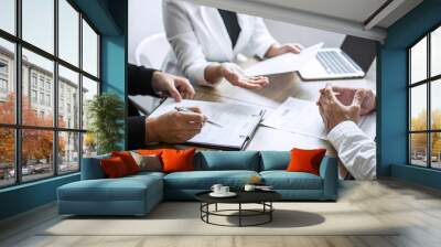 Employer or committee holding reading a resume with talking during about his profile of candidate, employer in suit is conducting a job interview, manager resource employment and recruitment concept Wall mural