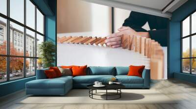 Risk and Strategy in Business, Image of hand stopping falling collapse wooden block dominoes effect from continuous toppled block, prevention and development to stability Wall mural