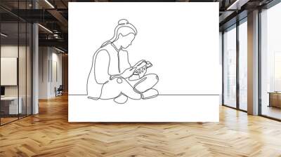 College girl study with reading a book continuous one line drawing, She sitting on the floor and enjoy the education. Wall mural