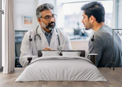 Indian Urologist with Patient Consultation - Indian male urologist discussing treatment options with a patient in a clinical setting, emphasizing specialized care in urology.
 Wall mural