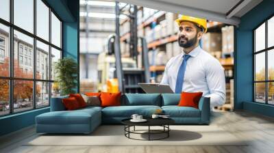 Indian Warehouse Manager Overseeing Loading and Unloading Operations with Racks in View
 Wall mural