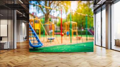 School Playground Blur: A blurred background of a school playground, with equipment such as swings and slides, illustrating a place for recreation and play.
 Wall mural