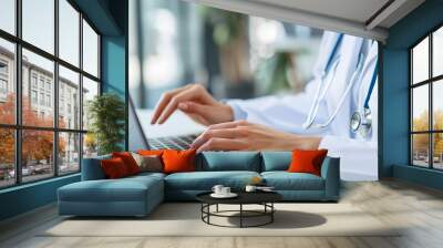 Modern Healthcare: Female Doctor Using Laptop in a Professional Setting with Blurred Background Wall mural