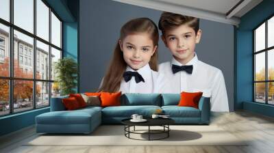 Front view of cute american girl and boy posing together, in school uniforms, one color background, copy space -generative ai Wall mural