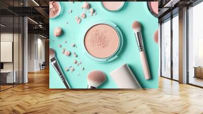 Gorgeous blush in various shades of beige and compact face powders set against a soft mint blue backdrop. Matte foundation in pastel, trendy colors. palette for eyeshadows. Makeup brushes and cosmetic Wall mural