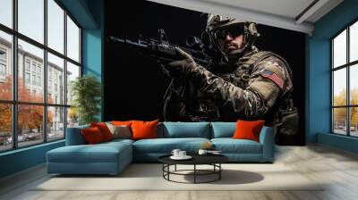 Special forces soldier holding a rifle on a black background.  Wall mural