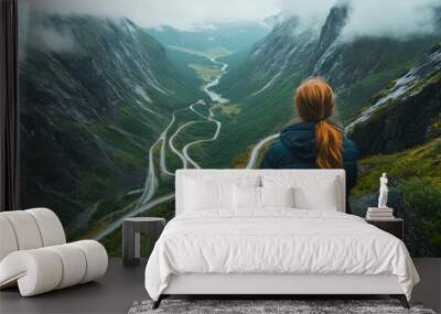 Tourists viewing a mountain road in Norway's Trollstigen, a breathtakingly beautiful location Wall mural