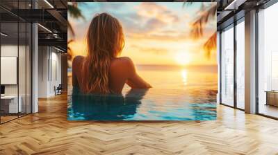 unwinding on the beach, a young lady in an opulent hotel near the swimming pool, and the stunning sunset Wall mural