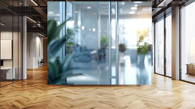 Blurred office interior background with panoramic windows and light from the window with green plant. Blurred office space with a business concept banner template  Wall mural