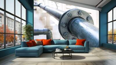 Steel fuel pipes green with fittings joint with new screws and nuts for oil and gas pipeline at building. Wall mural