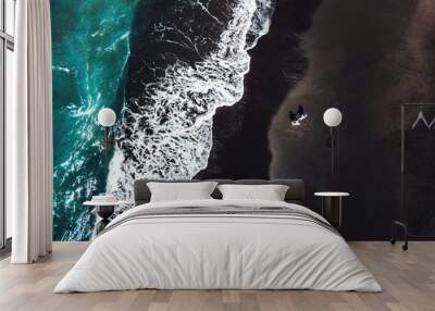 Happiness Couple enjoying on Black Sand Beach with white wave at Bali ,Indonesia Wall mural