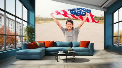 Happy asian little girl with American flag USA celebrate 4th of July Wall mural