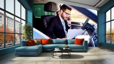 Businessman working from car Wall mural