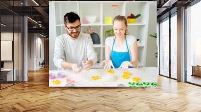 Couple cooking together Wall mural