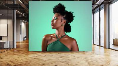 Beauty in green, makeup or black woman portrait of sexy afro model with fashion, facial makeup or hair care with designer jewelry. Trendy, cosmetics art or edgy girl from Atlanta in studio Wall mural