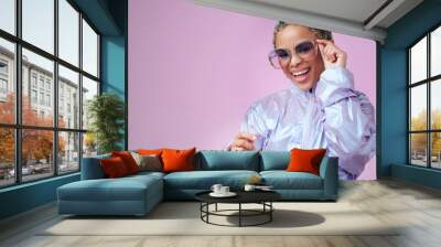 Edgy fashion, trendy and black woman with sunglasses in a studio with mockup space. Stylish, creative and portrait of an african girl influencer or model standing by a bright purple background. Wall mural