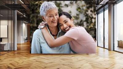 Happy, hug and portrait of a mother and woman in a garden on mothers day with love and gratitude. Smile, family and an adult daughter hugging a senior mom in a backyard or park for happiness Wall mural