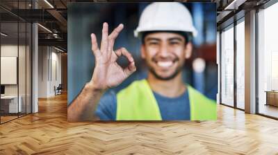 Happy man, architect and hands with okay sign for construction success or good job on site. Hand of male person, engineer or contractor showing OK emoji, yes or perfect gesture for architecture Wall mural