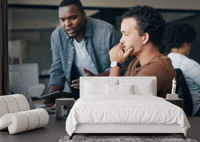 Im just going to give you some feedback on that. Shot of two young businessmen working together in an office. Wall mural