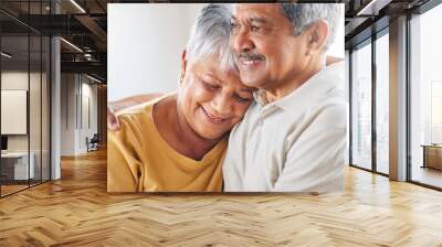 It still feels like the day we met. Shot of a senior couple relaxing at home. Wall mural